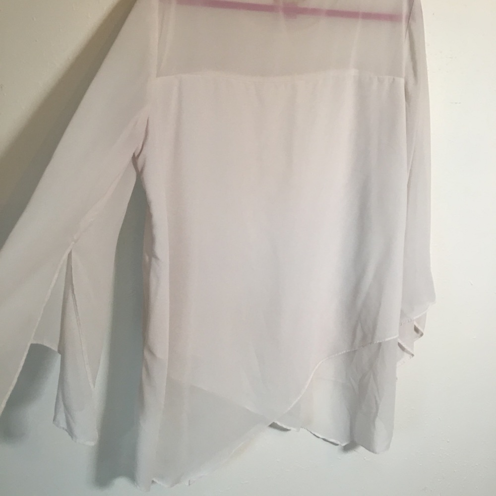 White a symmetrical long sleeve shirt